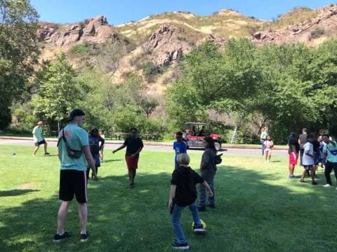 a group of people playing in a field