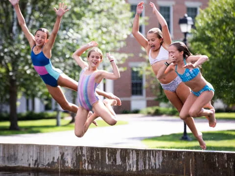 a group of women jumping in the air