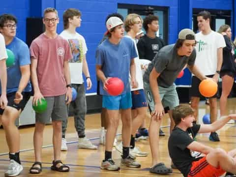 a group of people holding balls