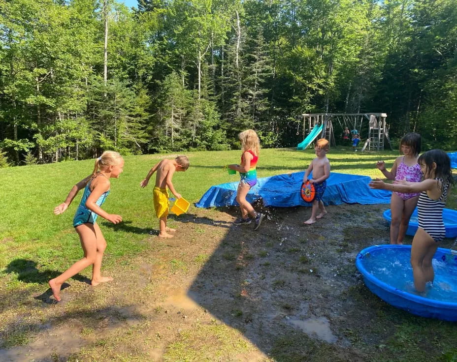 a group of children playing in a playground