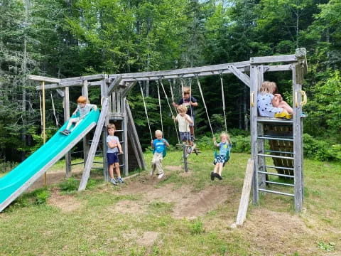 a group of kids playing on a playground