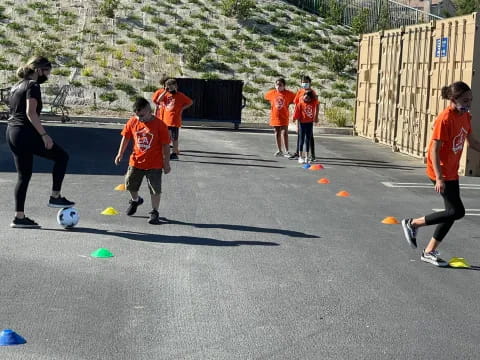 a group of people play football