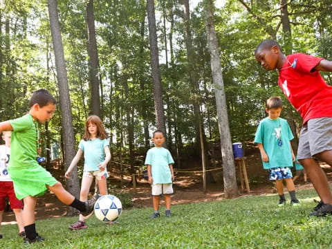 a group of kids playing football