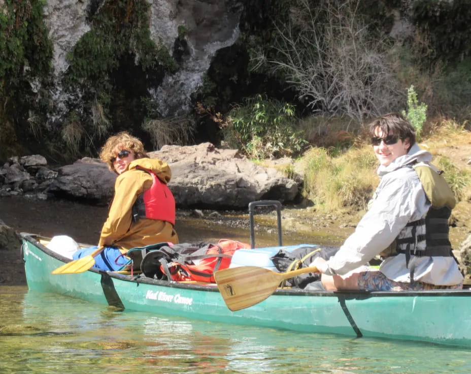 a group of people in a canoe