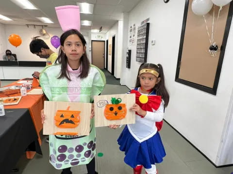 a person and a girl holding toys