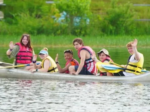 a group of people in a canoe