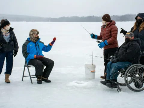 a group of people on a snowy field