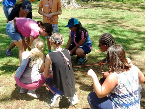 a group of people sitting on the ground