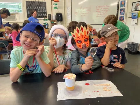 a group of children wearing masks