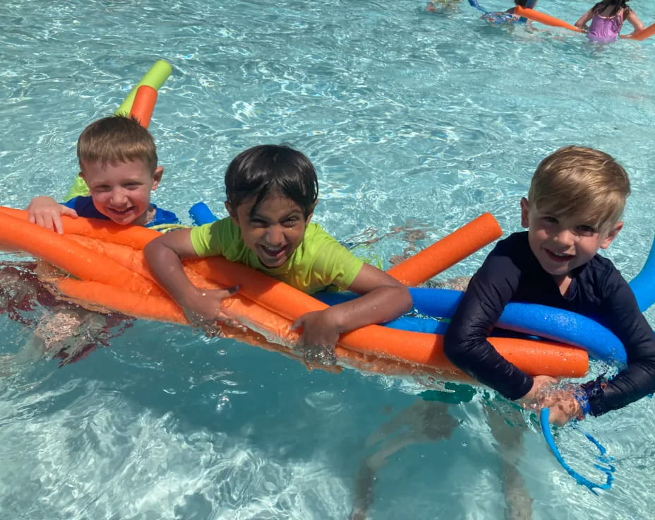 a group of kids in a pool