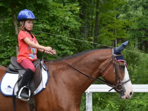 a girl riding a horse