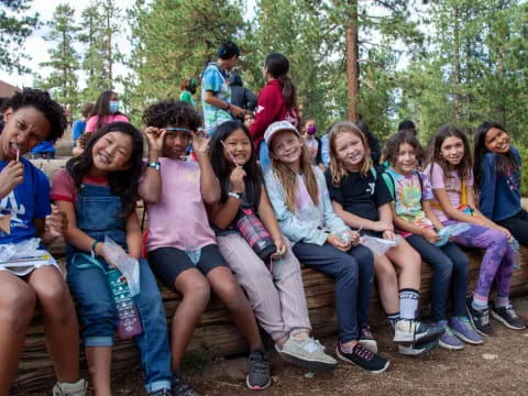 a group of people sitting on a bench