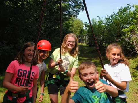 a group of children on a swing