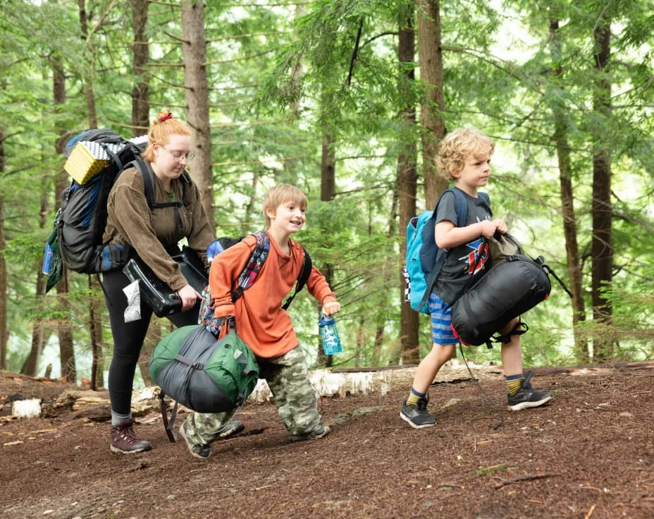 a group of people hiking in the woods