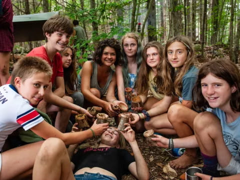 a group of people sitting together outside