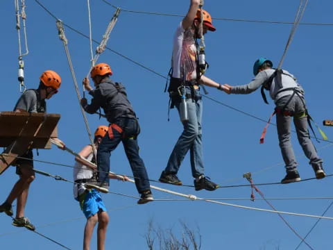 a group of people on a cable