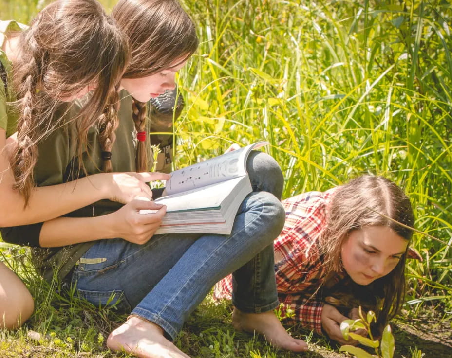 a group of women reading a book