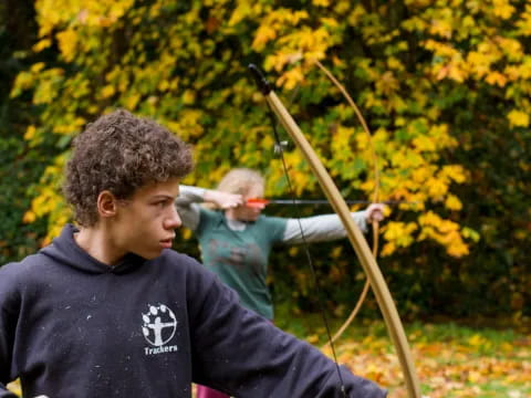 a man shooting a bow