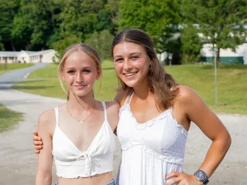 two women in white dresses