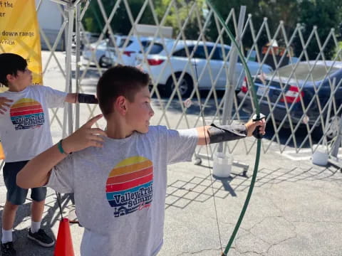 a boy holding a tool