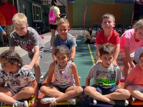 a group of children sitting on the ground