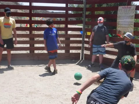 a person hitting a ball with the bat