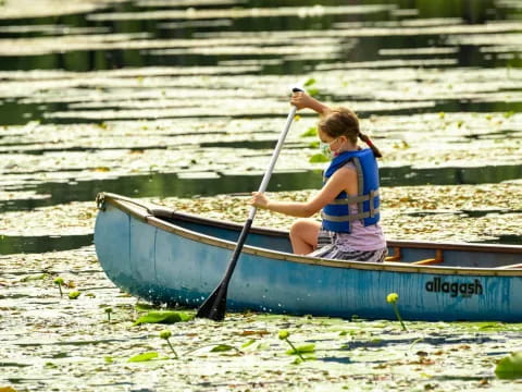 a girl in a boat