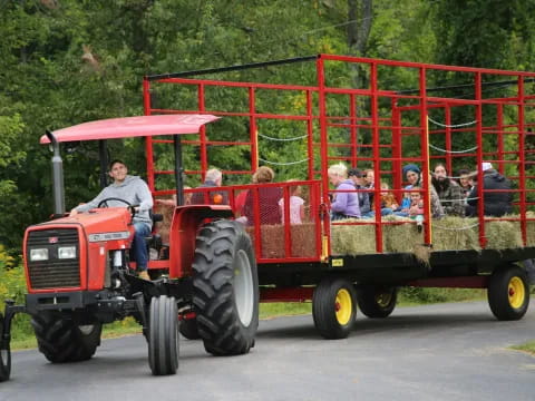 a tractor with a group of people in it