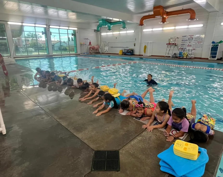 a group of people in a swimming pool