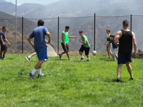 a group of people playing football