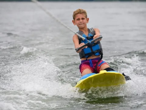 a boy on a surfboard