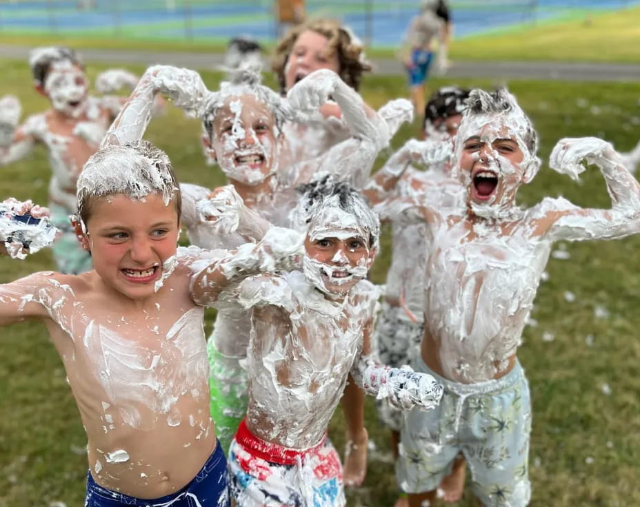 a group of people wearing white and blue clothing