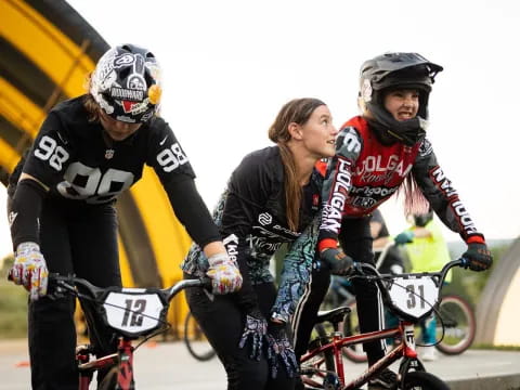 a group of people riding bikes