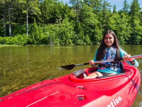 a person in a red kayak