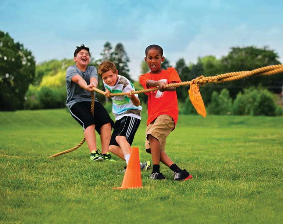 a group of people playing with a bow and arrow