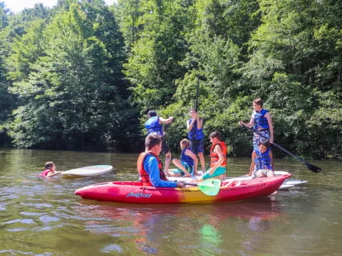 a group of people in a canoe