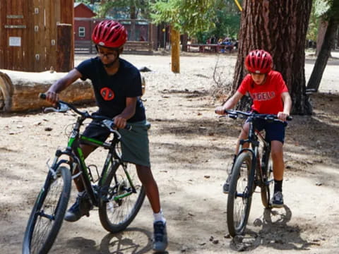 a couple of boys riding bikes