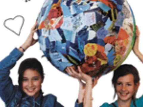 a couple of boys holding a globe