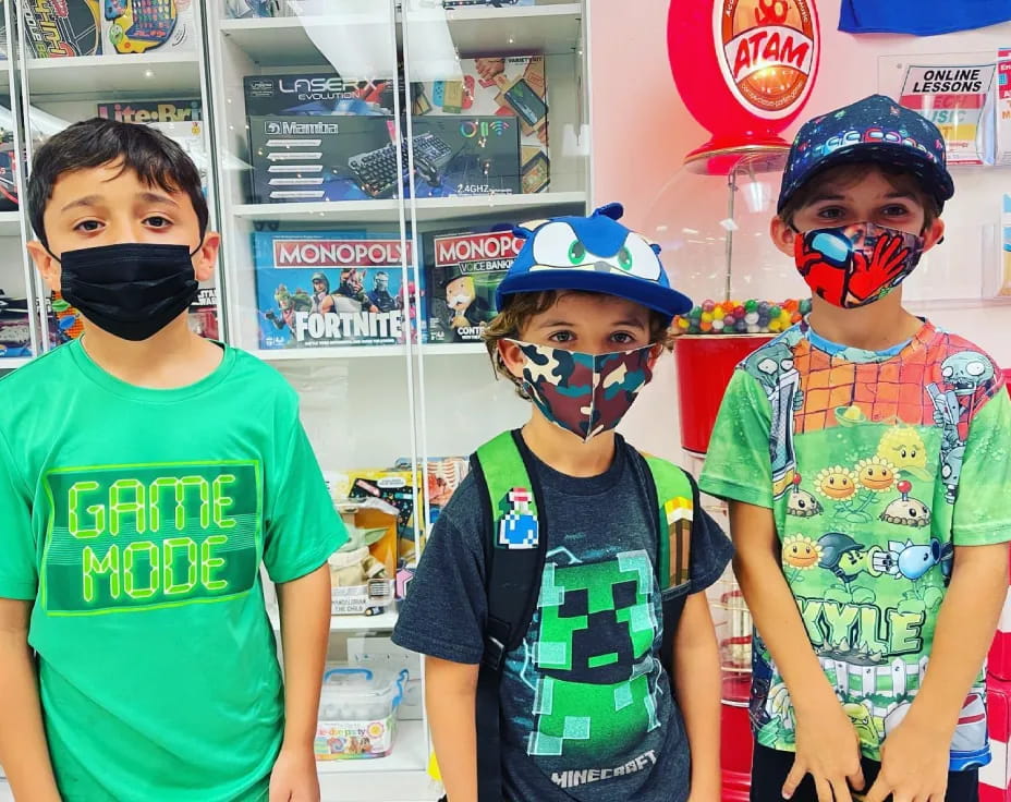 a group of boys wearing face masks