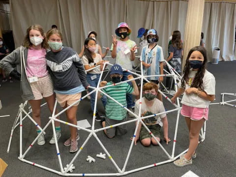 a group of people wearing masks