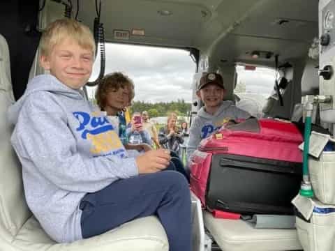 a group of kids in an airplane