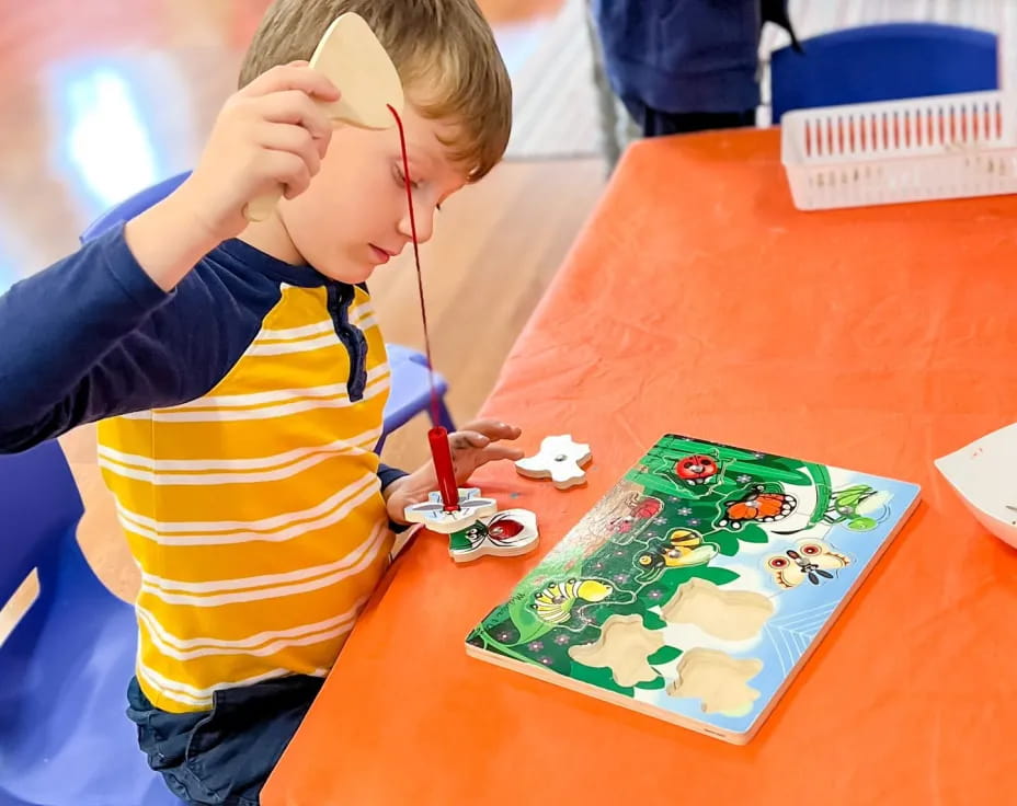 a child painting on a table