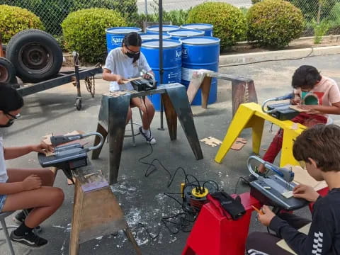 a group of people painting outside