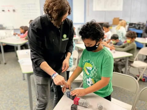 a man and a boy in a classroom