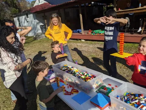 a group of people playing with toys