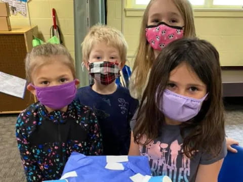 a group of children with paint on their faces