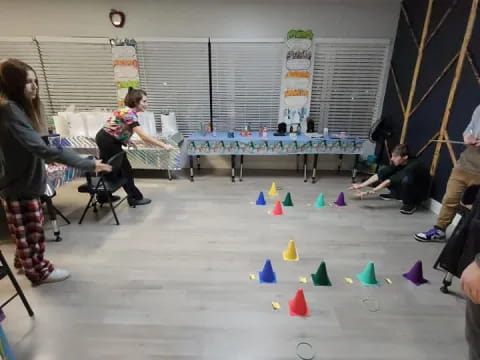 a group of people playing ping pong