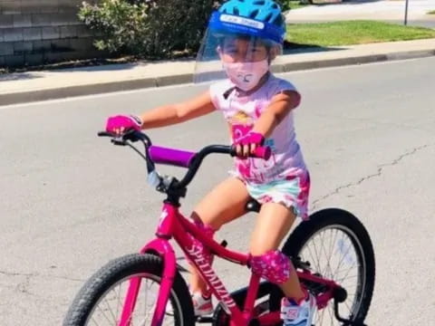 a girl riding a bike