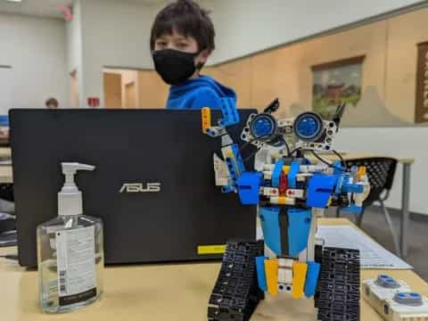 a boy using a computer