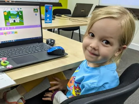 a child sitting at a desk